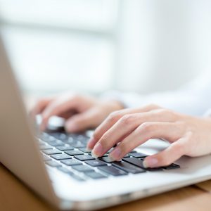 Woman working on laptop computer